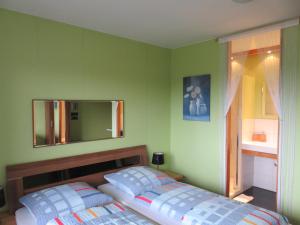 
Ein Bett oder Betten in einem Zimmer der Unterkunft Ferienhaus Osterfeld
