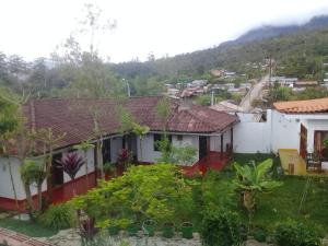 a view of a house with a mountain in the background at La Posada de Cuispes in Cuispes