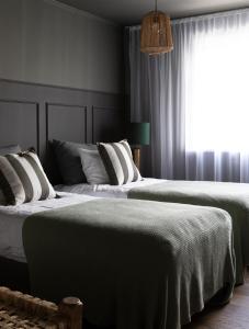 Кровать или кровати в номере INNI - Boutique apartments