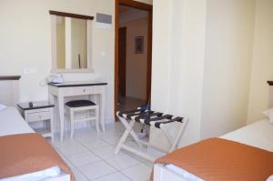 Postel nebo postele na pokoji v ubytování Mirabello Hotel