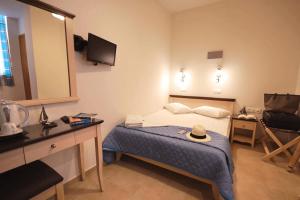 Postel nebo postele na pokoji v ubytování Mirabello Hotel