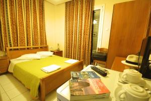 Postel nebo postele na pokoji v ubytování Mirabello Hotel
