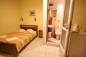 Postel nebo postele na pokoji v ubytování Mirabello Hotel