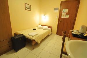 Postel nebo postele na pokoji v ubytování Mirabello Hotel