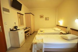 Postel nebo postele na pokoji v ubytování Mirabello Hotel