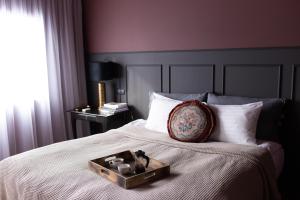 
A bed or beds in a room at INNI - Boutique apartments
