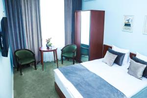 Voodi või voodid majutusasutuse Grand Fortune Hotel toas