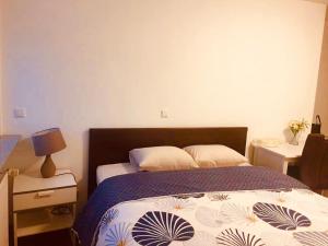 Postel nebo postele na pokoji v ubytování Apartment CHEZ TONY