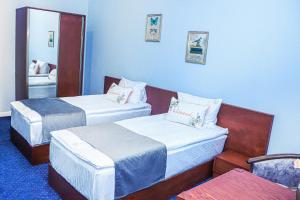 Voodi või voodid majutusasutuse Grand Fortune Hotel toas