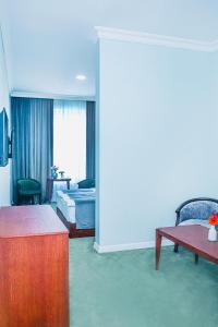 Voodi või voodid majutusasutuse Grand Fortune Hotel toas