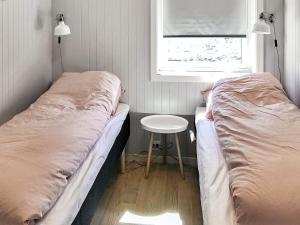 En eller flere senge i et værelse på 10 person holiday home in Brattvåg + 43 billeder