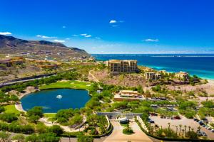 an aerial view of a resort with a lake and the ocean at Puerta Cortes Residences in La Paz