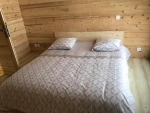 Säng eller sängar i ett rum på La grange à Gaspard