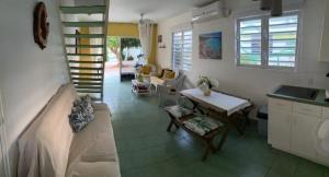 a living room with a couch and a table at Blue Lagoon Apartment in Lagun