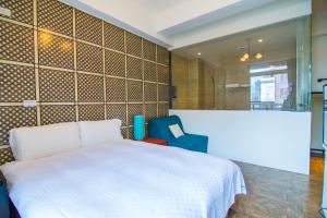 Cama o camas de una habitación en 馬公港精品旅宿包棟烤肉附設租車