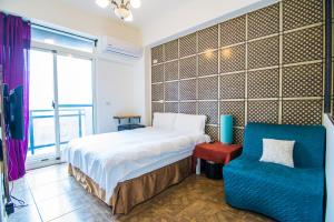 Cama o camas de una habitación en 馬公港精品旅宿包棟烤肉附設租車
