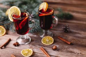 two glasses of mulled wine with orange slices on a table at Concerto Inn in Hong Kong