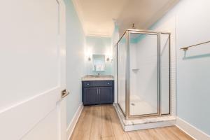 a bathroom with a shower and a sink at West Side Cottage #OO in Gulf Shores +141 photos
