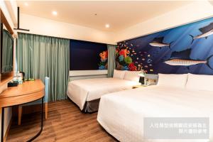 Postel nebo postele na pokoji v ubytování Fish Hotel Kaohsiung