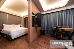 Postel nebo postele na pokoji v ubytování Fish Hotel Kaohsiung