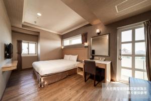 Krevet ili kreveti u jedinici u objektu Fish Hotel-Pingtung
