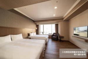 Krevet ili kreveti u jedinici u objektu Fish Hotel-Pingtung