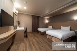 Krevet ili kreveti u jedinici u objektu Fish Hotel-Pingtung