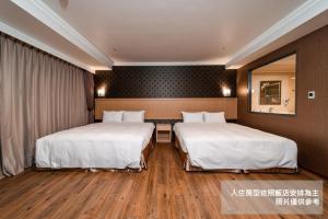 Krevet ili kreveti u jedinici u objektu Fish Hotel-Pingtung