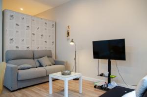 Televízia a/alebo spoločenská miestnosť v ubytovaní Integralix Lofts