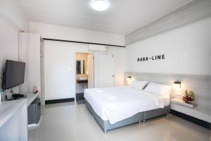 Llit o llits en una habitació de โรงแรมบาบาราย