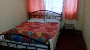 Postel nebo postele na pokoji v ubytování Backpackers Hostel