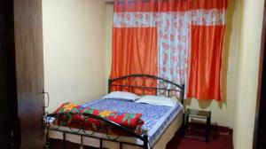 Postel nebo postele na pokoji v ubytování Backpackers Hostel
