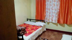Postel nebo postele na pokoji v ubytování Backpackers Hostel