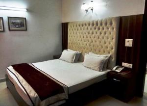 Postel nebo postele na pokoji v ubytování Solo Victoria Hotel
