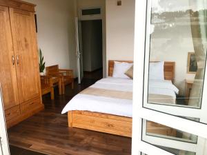 Postel nebo postele na pokoji v ubytování Spring Hotel