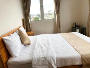 Postel nebo postele na pokoji v ubytování Spring Hotel