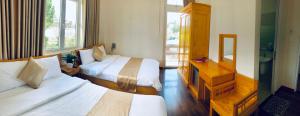 Postel nebo postele na pokoji v ubytování Spring Hotel