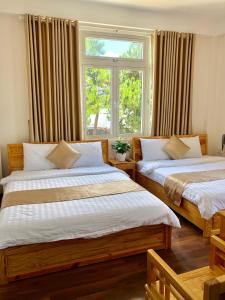 Postel nebo postele na pokoji v ubytování Spring Hotel