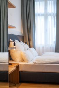 Voodi või voodid majutusasutuse Le Baldinger Boutique Hotel toas