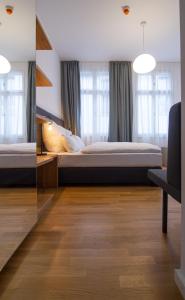 Voodi või voodid majutusasutuse Le Baldinger Boutique Hotel toas