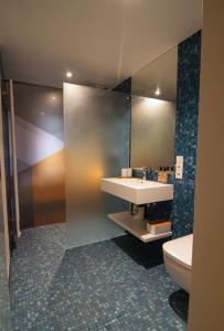 Vannituba majutusasutuses Le Baldinger Boutique Hotel