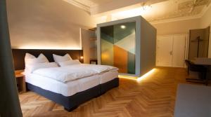 Voodi või voodid majutusasutuse Le Baldinger Boutique Hotel toas