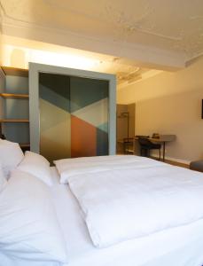 Voodi või voodid majutusasutuse Le Baldinger Boutique Hotel toas