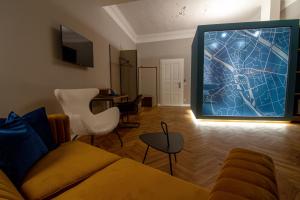 Televiisor ja/või meelelahutuskeskus majutusasutuses Le Baldinger Boutique Hotel