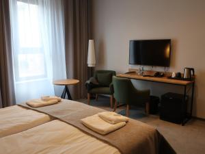 Ein Bett oder Betten in einem Zimmer der Unterkunft FOLGA - Hotel, Restauracja, Browar, SPA