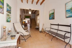 a living room with two chairs and a couch at Ca na Miquela in El Arenal