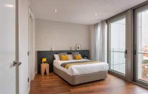 Łóżko lub łóżka w pokoju w obiekcie Gran View Apartments