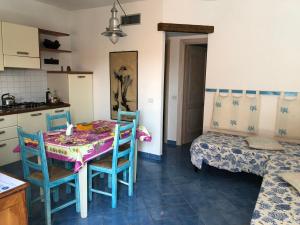 a kitchen with a table and chairs in a room at Tiffany Palau in Palau