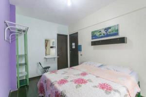 a bedroom with a bed and a ladder in it at riosoleilcopacabana in Rio de Janeiro