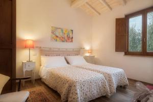 Postel nebo postele na pokoji v ubytování Agriturismo Renello